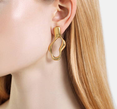 boucles d’oreilles créoles liquides en or